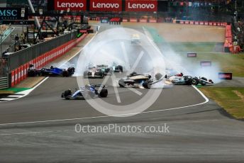 World © Octane Photographic Ltd. Formula 1 – British Grand Prix - Silverstone. Sunday 3rd July 2022. Race. Alfa Romeo F1 Team Orlen C42 - Guanyu Zhou slides inverted towards the gravel trap and barrier as Williams Racing FW44 - Alex Albon impacts the pit wall.