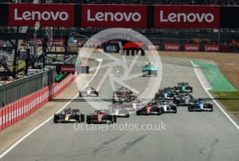 World © Octane Photographic Ltd. Formula 1 – British Grand Prix - Silverstone. Sunday 3rd July 2022. Race. Scuderia Ferrari F1-75 - Carlos Sainz and Oracle Red Bull Racing RB18 – Max Verstappen fight for the lead at the start.