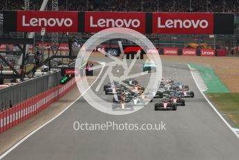 World © Octane Photographic Ltd. Formula 1 – British Grand Prix - Silverstone. Sunday 3rd July 2022. Race. Oracle Red Bull Racing RB18 – Max Verstappen and Scuderia Ferrari F1-75 - Carlos Sainz head the pack with Mercedes-AMG Petronas F1 Team F1 W13 - Lewis Hamilton and Scuderia Ferrari F1-75 - Charles Leclerc behind.