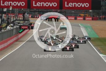 World © Octane Photographic Ltd. Formula 1 – British Grand Prix - Silverstone. Sunday 3rd July 2022. Race. Oracle Red Bull Racing RB18 – Max Verstappen and Scuderia Ferrari F1-75 - Carlos Sainz head the pack with Mercedes-AMG Petronas F1 Team F1 W13 - Lewis Hamilton and Scuderia Ferrari F1-75 - Charles Leclerc behind.