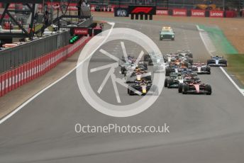 World © Octane Photographic Ltd. Formula 1 – British Grand Prix - Silverstone. Sunday 3rd July 2022. Race. Oracle Red Bull Racing RB18 – Max Verstappen and Scuderia Ferrari F1-75 - Carlos Sainz head the pack with Mercedes-AMG Petronas F1 Team F1 W13 - Lewis Hamilton and Scuderia Ferrari F1-75 - Charles Leclerc behind as BWT Alpine F1 Team A522 - Esteban Ocon runs wide at the back.