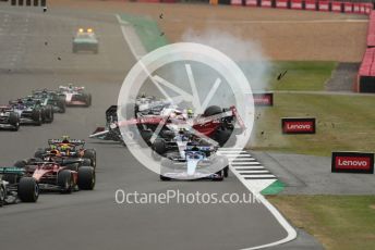 World © Octane Photographic Ltd. Formula 1 – British Grand Prix - Silverstone. Sunday 3rd July 2022. Race. The Alfa Romeo F1 Team Orlen C42 of Guanyu Zhou is launched by the Mercedes-AMG Petronas F1 Team F1 W13 of George Russell.