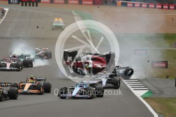 World © Octane Photographic Ltd. Formula 1 – British Grand Prix - Silverstone. Sunday 3rd July 2022. Race. The Alfa Romeo F1 Team Orlen C42 of Guanyu Zhou is launched by the Mercedes-AMG Petronas F1 Team F1 W13 of George Russell as the Williams Racing FW44 of Alex Albon and the Aston Martin Aramco Cognizant F1 Team AMR22 of Lance Stroll come into contact.