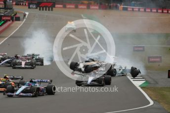 World © Octane Photographic Ltd. Formula 1 – British Grand Prix - Silverstone. Sunday 3rd July 2022. Race. The Alfa Romeo F1 Team Orlen C42 of Guanyu Zhou is launched by the Mercedes-AMG Petronas F1 Team F1 W13 of George Russell as the Williams Racing FW44 of Alex Albon and the Aston Martin Aramco Cognizant F1 Team AMR22 of Lance Stroll come into contact.