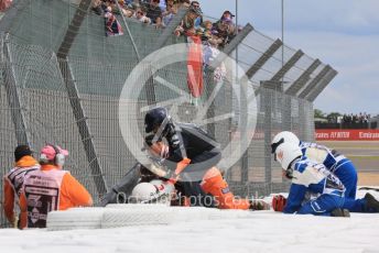 World © Octane Photographic Ltd. Formula 1 – British Grand Prix - Silverstone. Sunday 3rd July 2022. Race. Alfa Romeo F1 Team Orlen C42 - Guanyu Zhou's car wedged behind the barrier with him still in it.