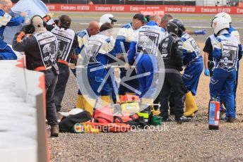 World © Octane Photographic Ltd. Formula 1 – British Grand Prix - Silverstone. Sunday 3rd July 2022. Race. Alfa Romeo F1 Team Orlen C42 - Guanyu Zhou is taken to the medical centre for a check up, later released uninjured.