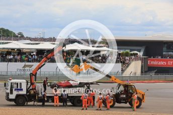 World © Octane Photographic Ltd. Formula 1 – British Grand Prix - Silverstone. Sunday 3rd July 2022. Race. Alfa Romeo F1 Team Orlen C42 - Guanyu Zhou'scar is loaded onto the recovery lorry.