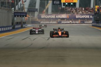 World © Octane Photographic Ltd. Formula 1 – Singapore Grand Prix - Marina Bay, Singapore. Friday 30th September 2022. Practice 1. McLaren F1 Team MCL36 - Daniel Ricciardo and Alfa Romeo F1 Team Orlen C42 - Guanyu Zhou.