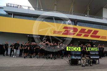 World © Octane Photographic Ltd. Mercedes AMG Petronas - The team gather behind the Nico Rosberg and Lewis Hamilton boards. Sunday 9th October 2016, F1 Japanese GP - World Constructors Champions 2016 celebrations. Suzuka Circuit, Suzuka, Japan. Digital Ref :1738LB2D4530