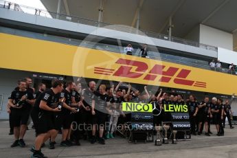 World © Octane Photographic Ltd. Mercedes AMG Petronas - The team celebrate behind the Nico Rosberg and Lewis Hamilton boards. Sunday 9th October 2016, F1 Japanese GP - World Constructors Champions 2016 celebrations. Suzuka Circuit, Suzuka, Japan. Digital Ref :1738LB2D4548