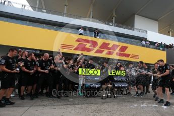 World © Octane Photographic Ltd. Mercedes AMG Petronas - The team celebrate behind the Nico Rosberg and Lewis Hamilton boards. Sunday 9th October 2016, F1 Japanese GP - World Constructors Champions 2016 celebrations. Suzuka Circuit, Suzuka, Japan. Digital Ref :1738LB2D4577