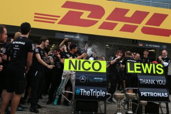 World © Octane Photographic Ltd. Mercedes AMG Petronas - The team celebrate behind the Nico Rosberg and Lewis Hamilton boards. Sunday 9th October 2016, F1 Japanese GP - World Constructors Champions 2016 celebrations. Suzuka Circuit, Suzuka, Japan. Digital Ref :1738LB2D4601